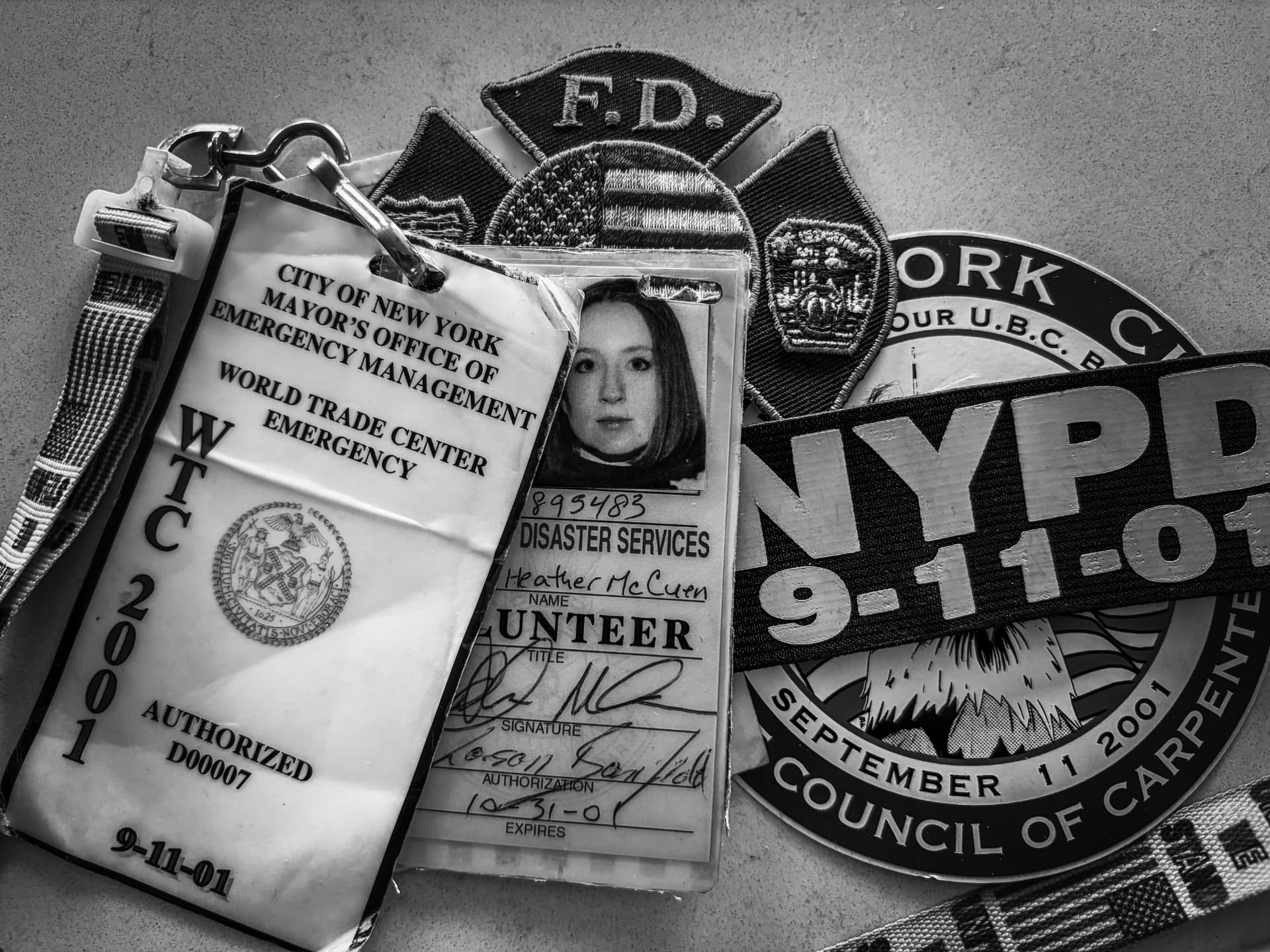 Heather McCuen's World Trade Center Emergency access badge, Disaster Services volunteer ID, and FDNY and NYPD September 11, 2001 patches